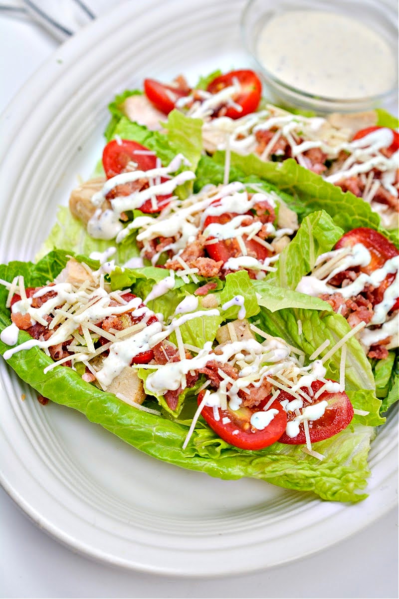 Chicken Caesar Romaine Lettuce Boats on a round white plate