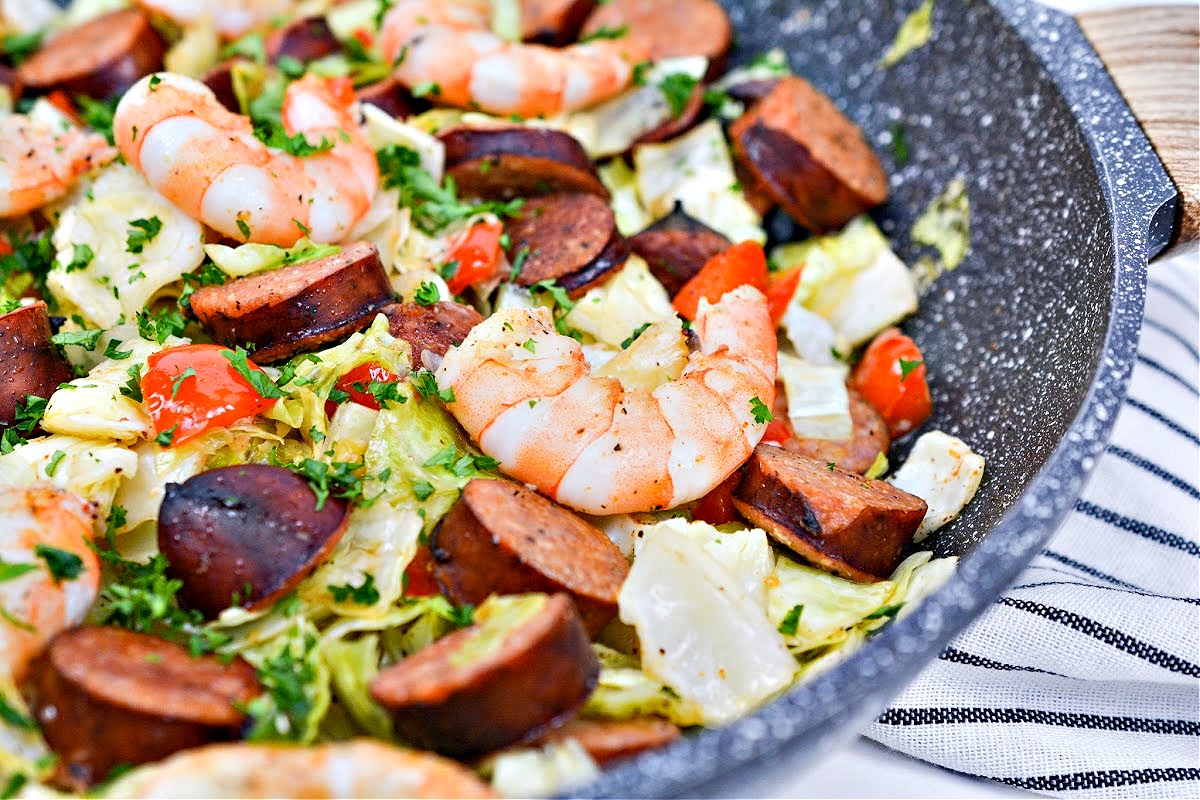 Shrimp and Sausage in a skillet with cabbage
