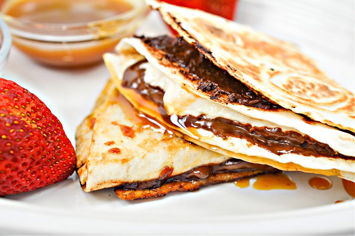 A close-up of two smores quesadillas on a plate