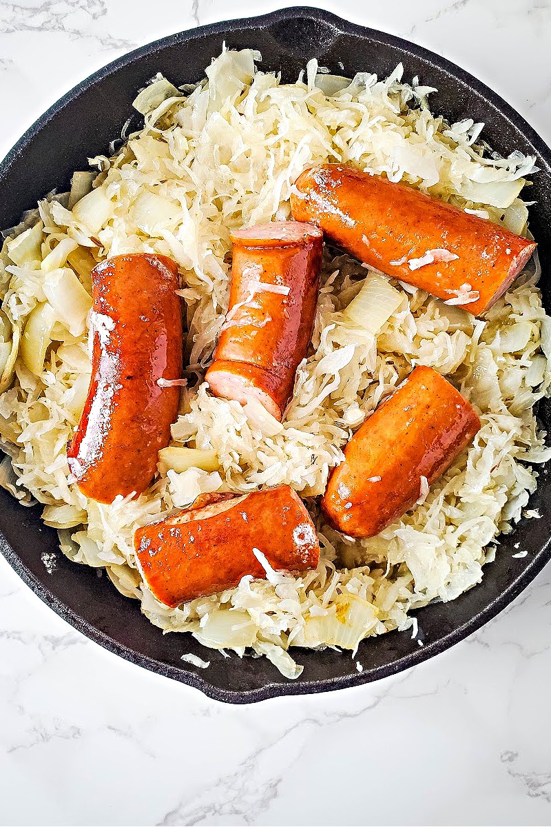 Kielbasa and sauerkraut in a skillet