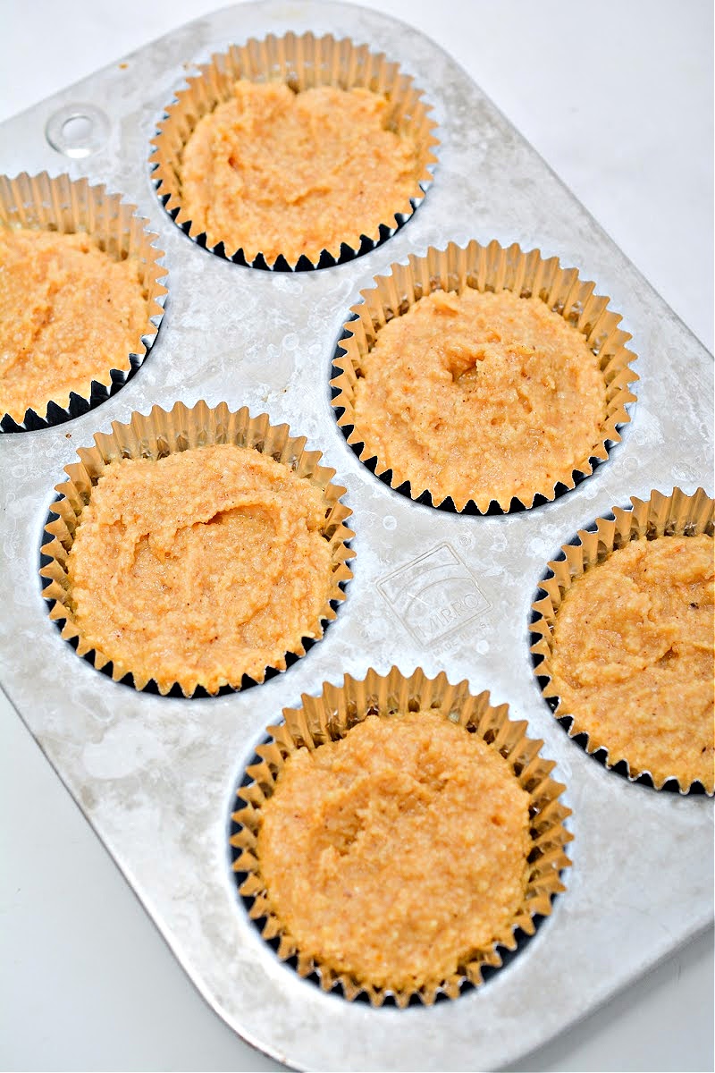 Pumpkin batter in a muffin tin