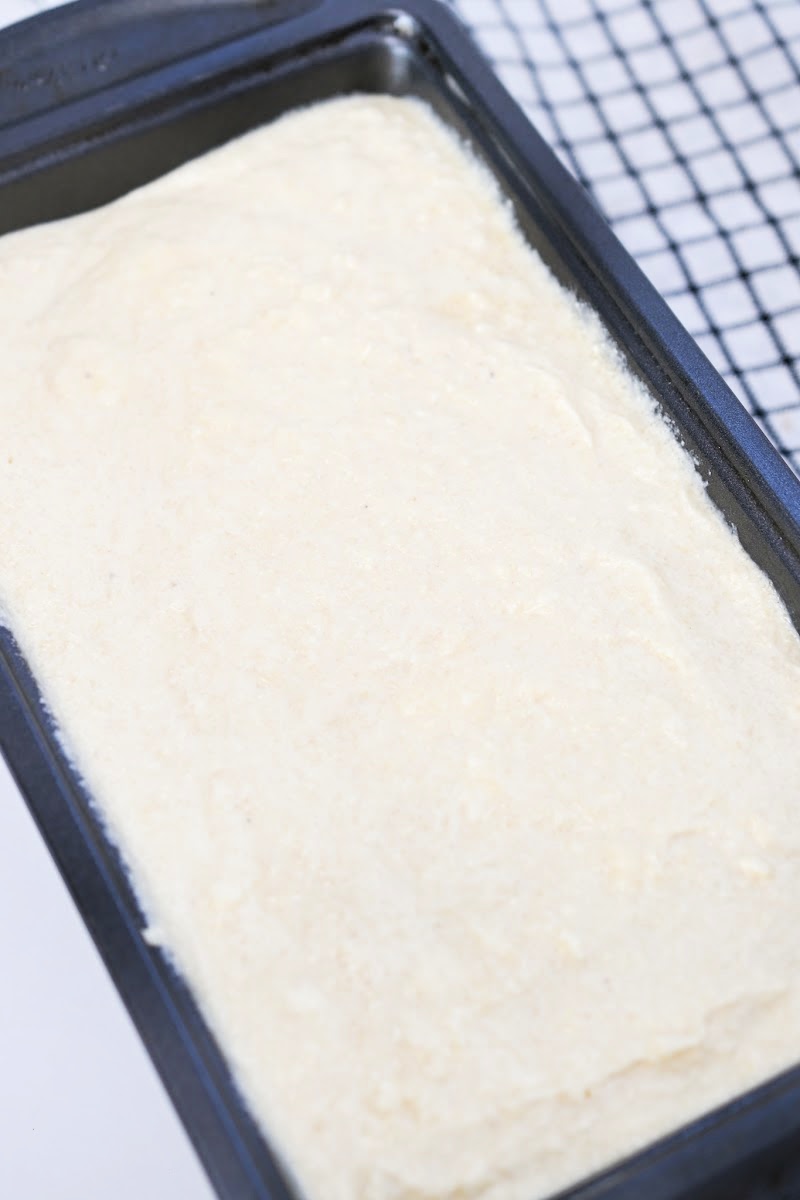 Frosted cake in a loaf pan.