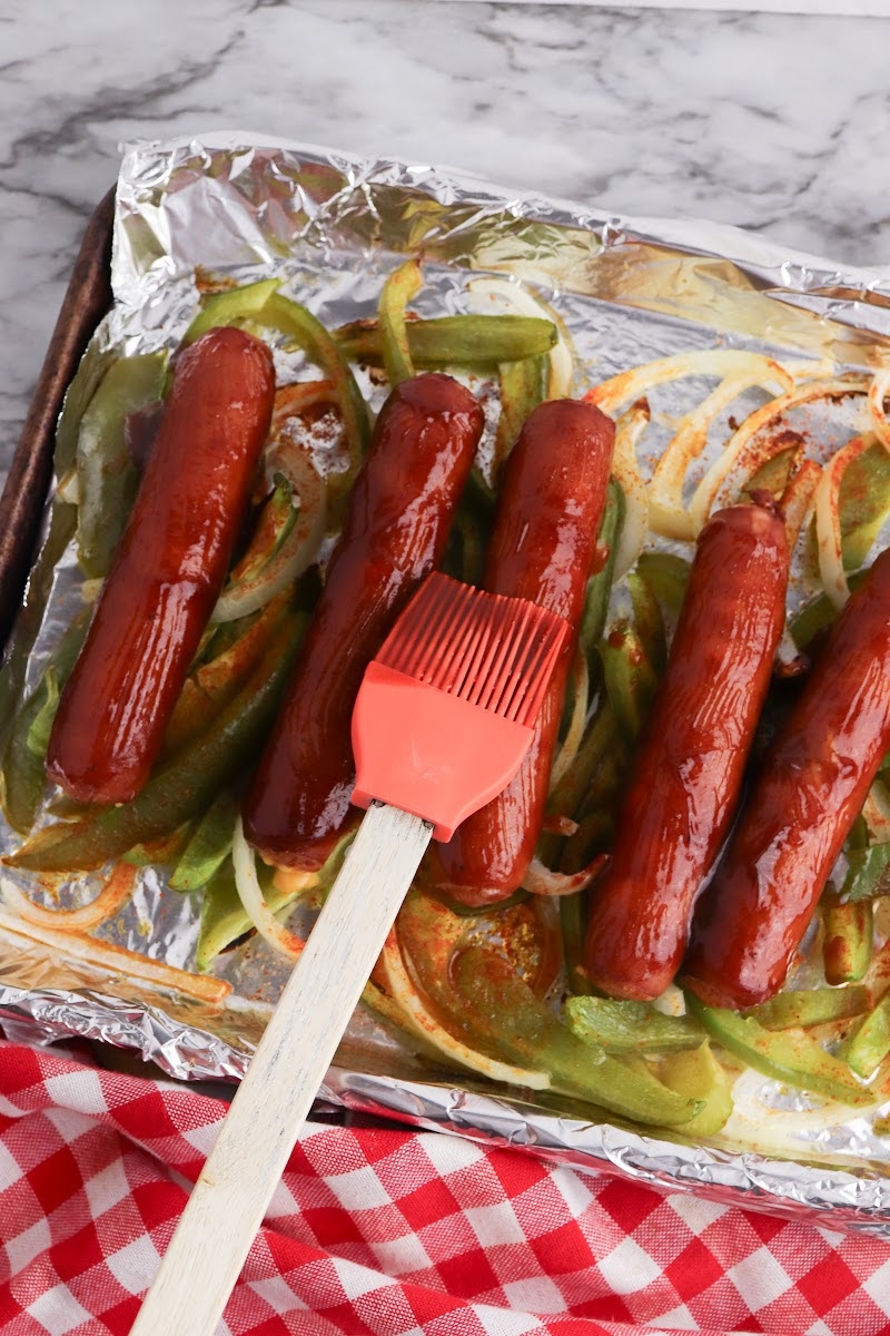 Adding BBQ Sauce to the sausages