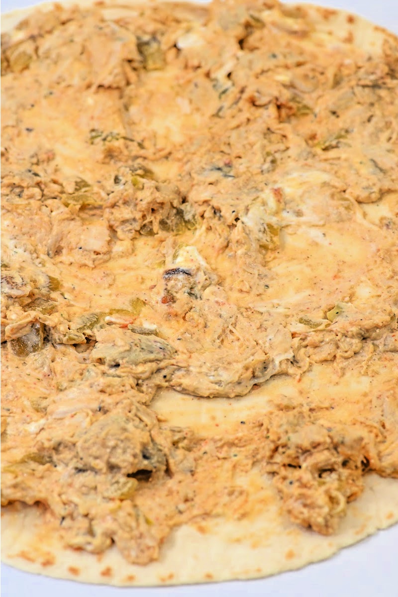 Spreading the filling onto the tortilla
